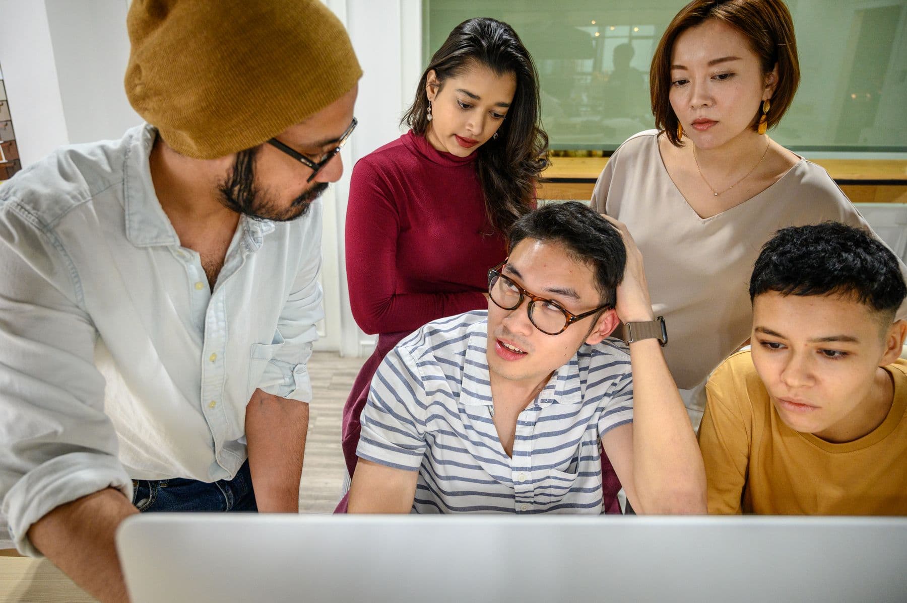 A product and engineering team working together in a modern office