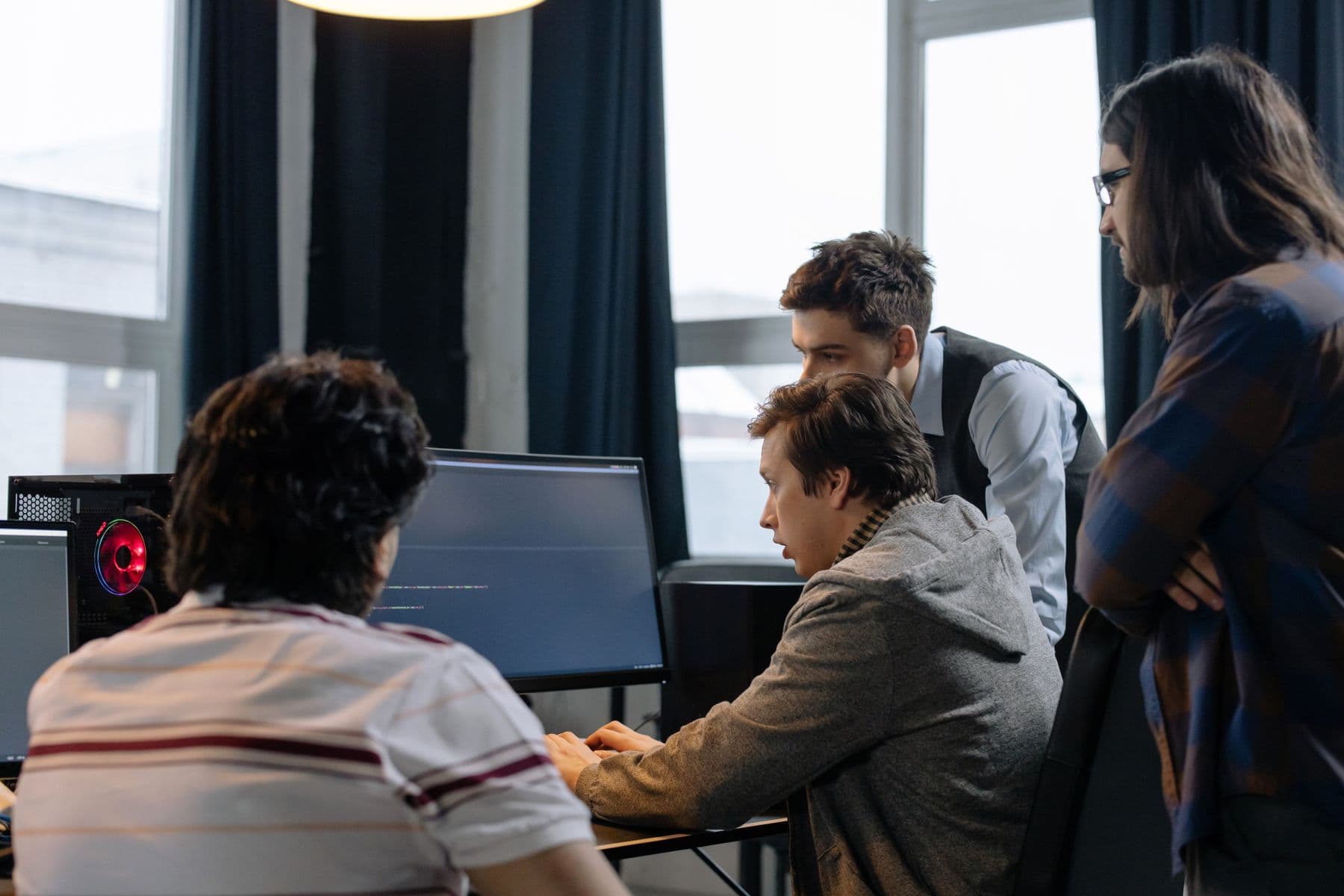 Software developers collaborating and reviewing their work
